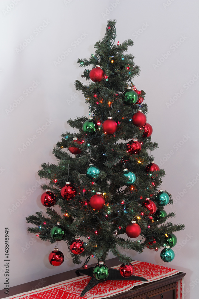 Small Christmas Tree on a Bureau in a Corner