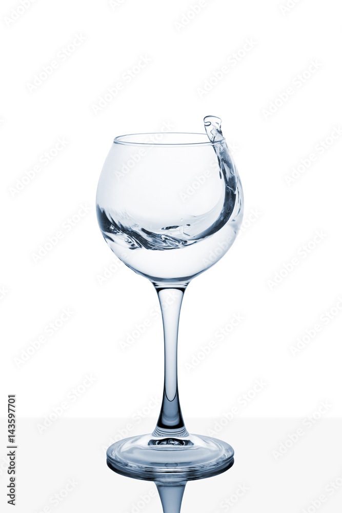 Water splashing out of a tall wine glass Water splashing out of a tall wine glass