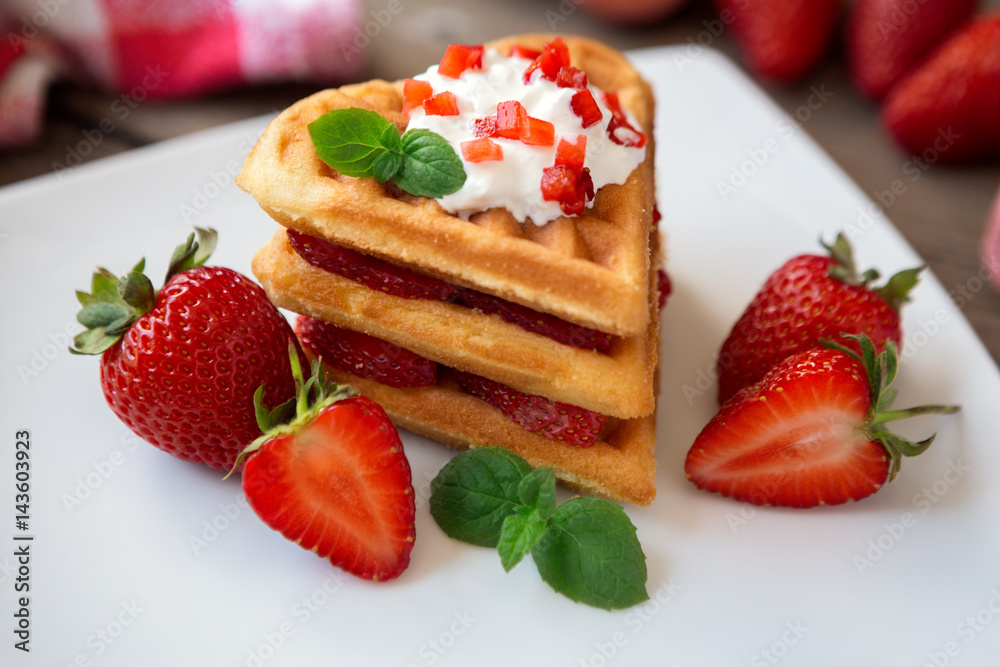 waffles with whipped cream and strawberries. waffles with whipped cream and strawberries.