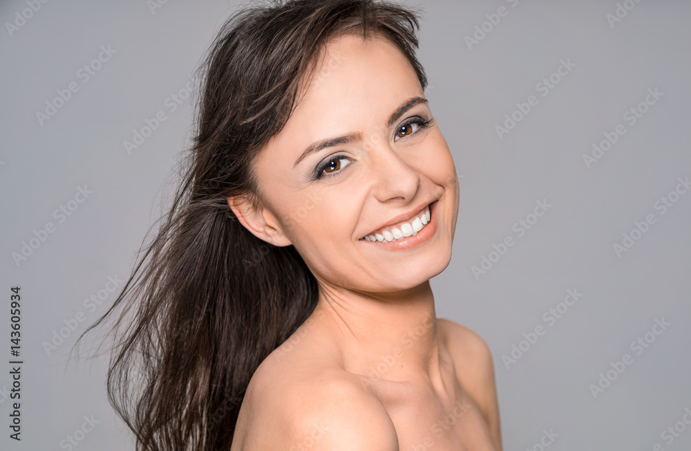 Portrait of a young, beautiful and smiling young woman.