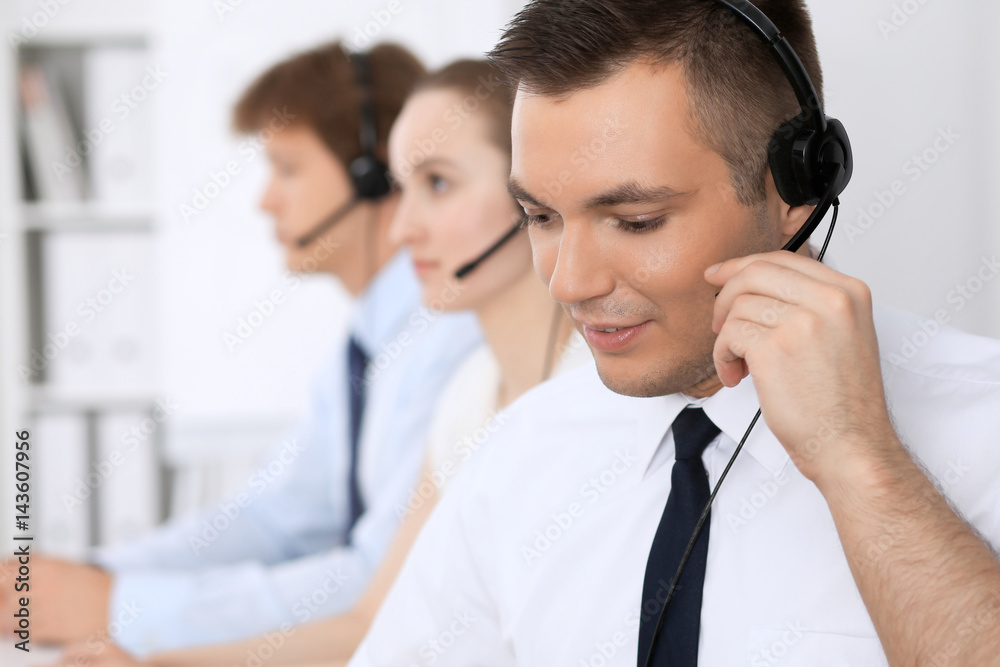 Young business man in headset. Call center. Young business man in headset. Call center.