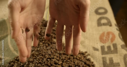 Woman spilling coffee beans from hands, slow motion. High quality 4k