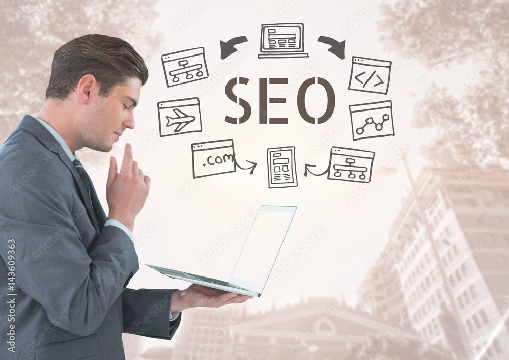Businessman with tablet and SEO text with drawings graphics