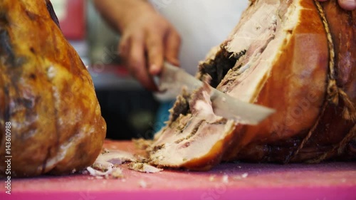 Piece of pork being cut for sandwiches in Italy, 4K
