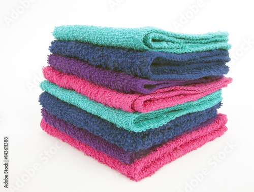 Front and side view of stacked washcloths. Isolated. © Noel