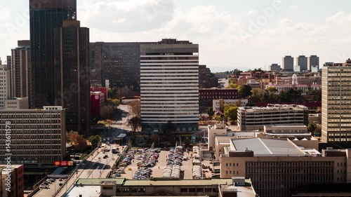 A slow panning timelapse across the city centre of Johannesburg (CBD) in the daytime showing Park Station, Gautrain, the City Counsel, Constitution Hill and more, South Africa photo