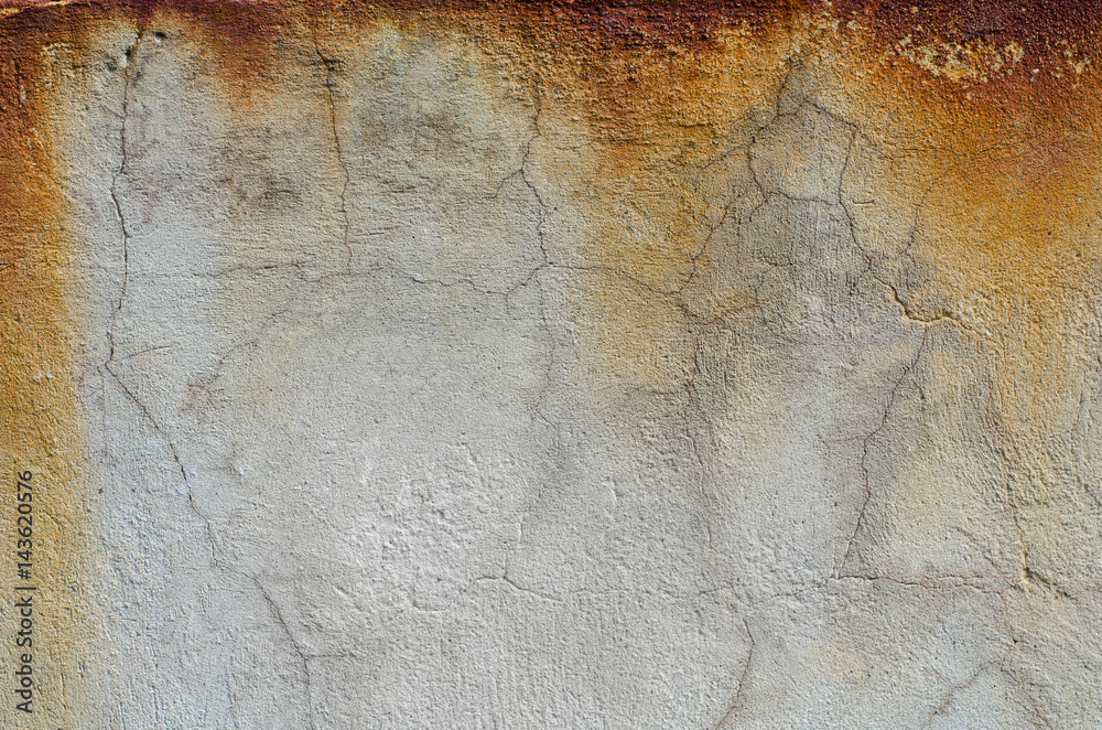 Rust on the gray concrete wall. Texture.