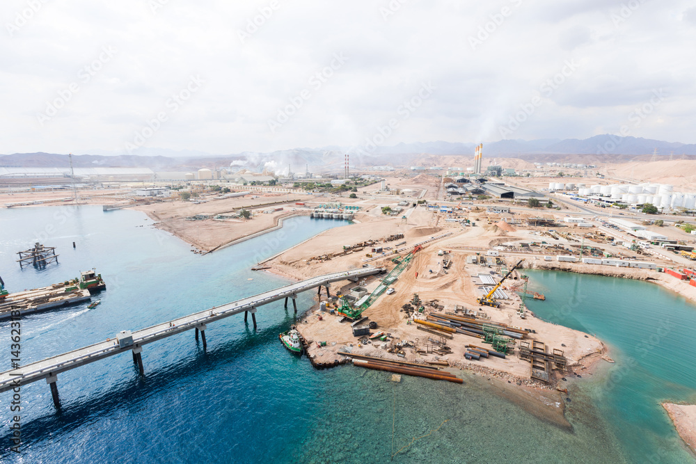 Aqaba, Jordan, 10/10/2015, Metal and concrete Jetty foundation construction at the Aqaba new port photographed from above