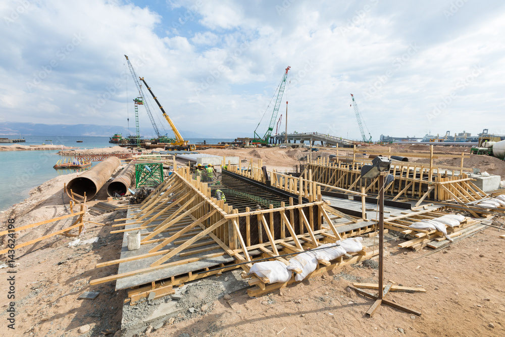 Aqaba, Jordan, 10/10/2015, Foundation construction at the Aqaba new port, using wood and steel. Aqaba, Jordan, 10/10/2015, Foundation construction at the Aqaba new port, using wood and steel.