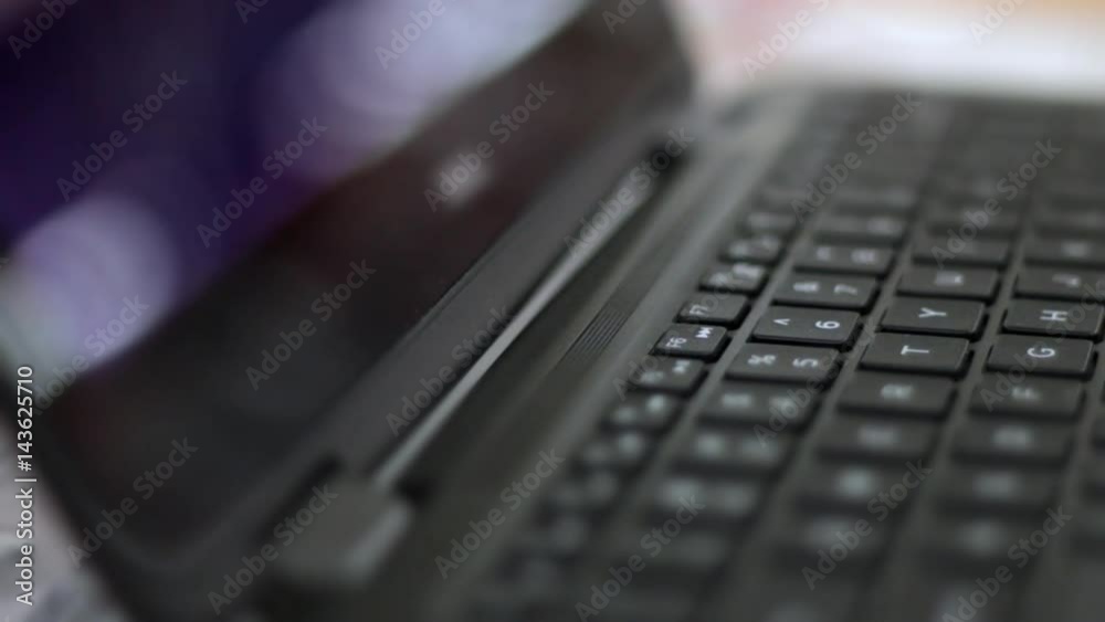 Shallow depth of field on a laptop playing generic movie animations Shallow depth of field on a laptop playing generic movie animations