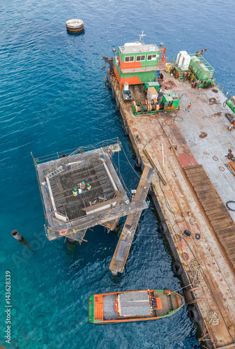 Aqaba, Jordan, 10/10/2015, Metal and concrete Jetty foundation construction at the Aqaba new port photographed from above © dannyburn