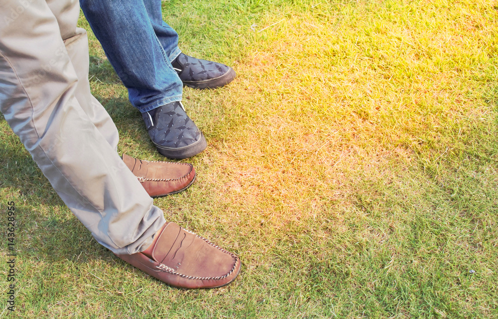 Two man casual leather brown shoes is standing in a relaxed. Two man casual leather brown shoes is standing in a relaxed.