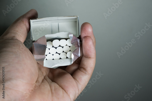 Hand holding a cigarettes pack