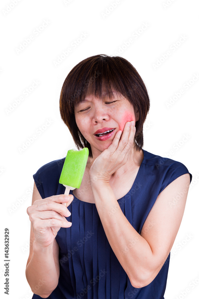 Asian women suffering intense toothache pain after biting ice cream Asian women suffering intense toothache pain after biting ice cream