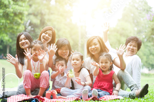 Asian multi generations family outdoor fun