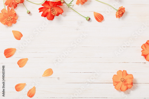 Fototapeta Naklejka Na Ścianę i Meble -  orange summer flowers on white wooden background
