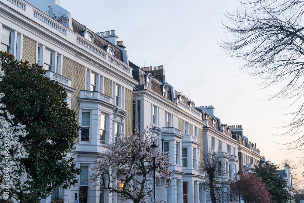 London - March 30: Iconic traditional row of town houses in Kensington during springtime on March 30, 2017.