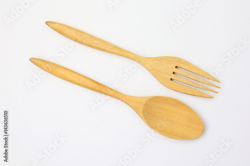 wooden spoon and fork on white background