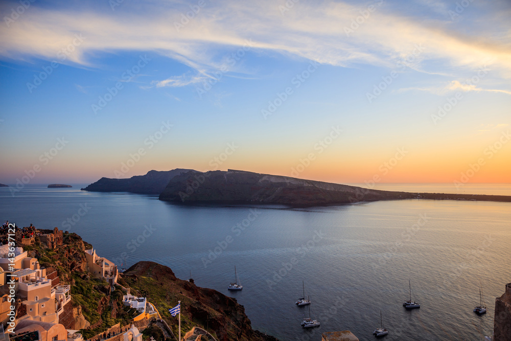 Fototapeta premium Santorini island, Greece - Caldera over Aegean sea at sunset