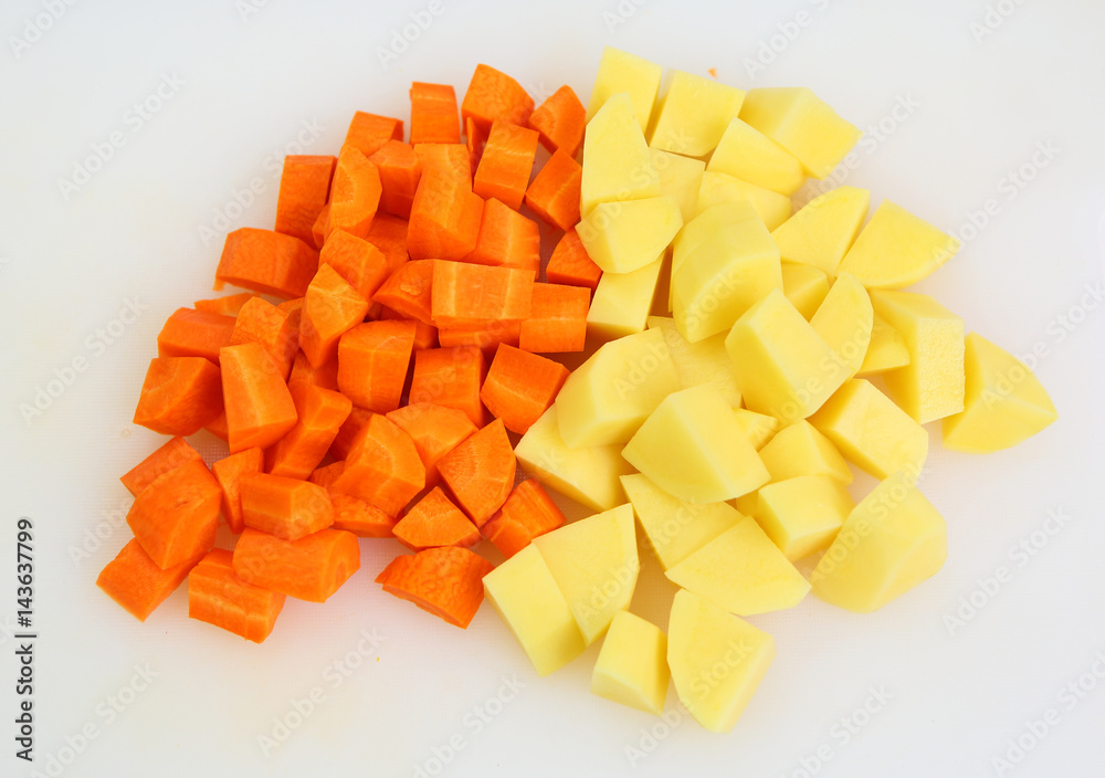 Chopped and sliced carrot and potatoes Chopped and sliced carrot and potatoes
