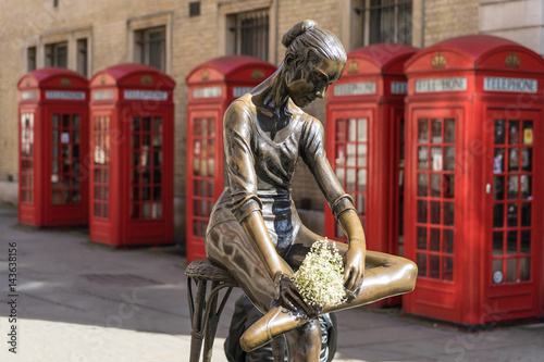 London - March 30: Prima ballerina statue in covent garden with iconic red telephone booth on March 30, 2017.