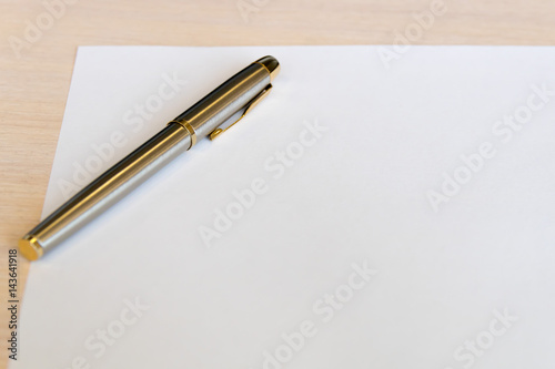 Steel pen on white sheet of paper