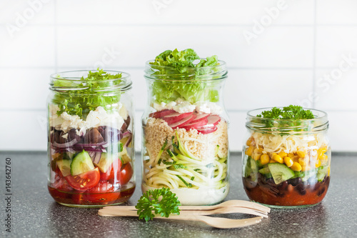 healthy vegetable cheese salad in mason jars