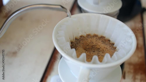 Barista Preparing Filtered Coffee at Coffee Shop. Closeup. photo
