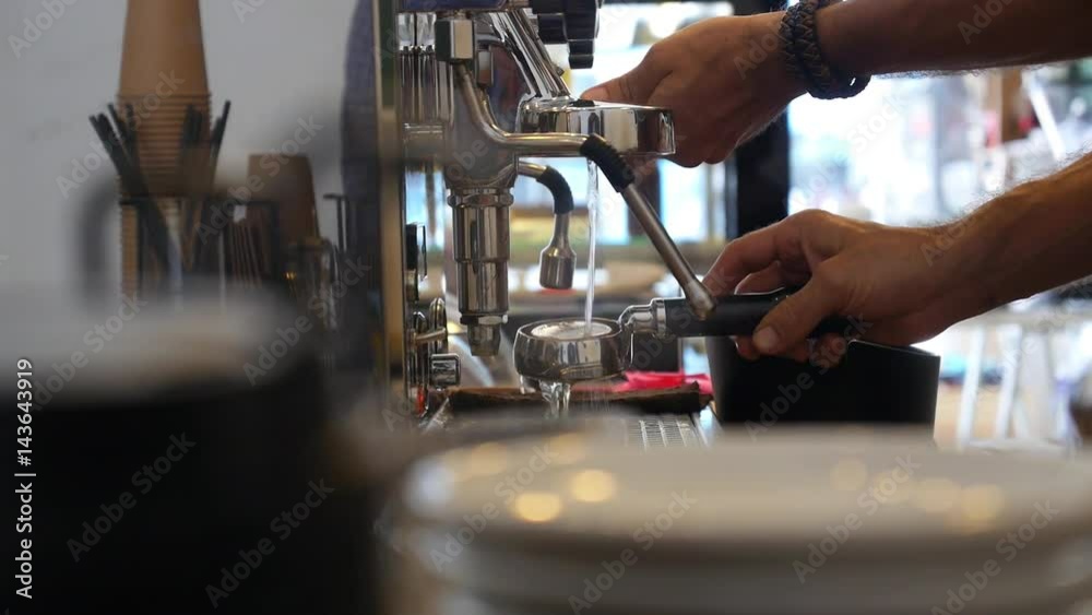 Barista Hands Prepare Coffee in Machine Closeup Barista Hands Prepare Coffee in Machine Closeup