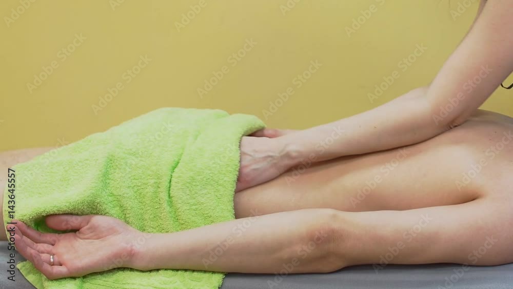 Young Man Having Relaxing Back Massage in Spa Young Man Having Relaxing Back Massage in Spa