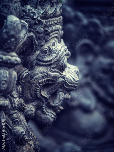 Stone sculpture on entrance door of the Temple in Bali © Netfalls