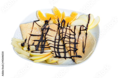 Fotografie fresh hot blini with apple, orange and chocolate isolated on white background