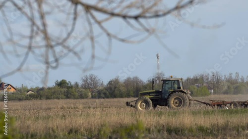 Tractor ploughing the field