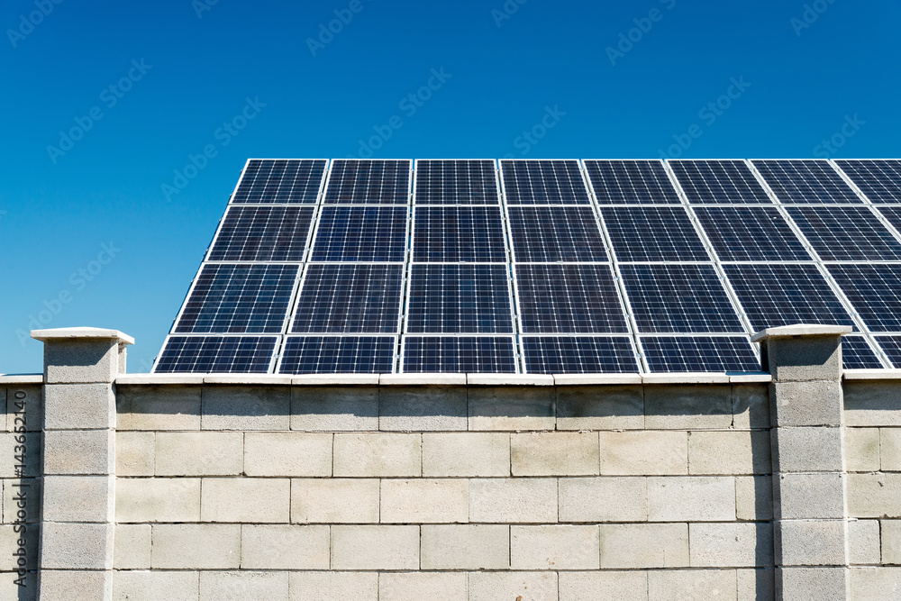 Fototapeta premium Solar panel, photovoltaic, alternative electricity source - selective focus, copy space