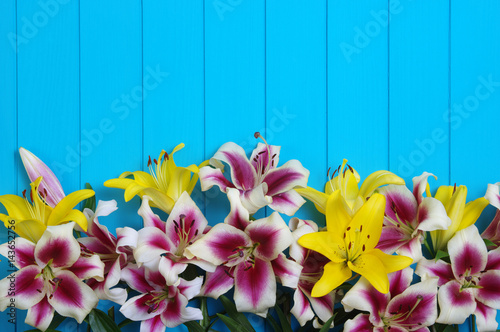  lily flowers on wooden planks