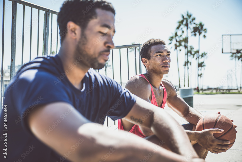 Fototapeta premium Two basketball players playing outdoor in LA