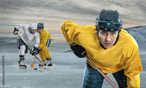 Photography Ice hockey player on the ice in mountains