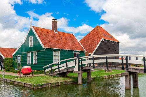 Typical wooden houses and small creek in famous village of Zaanse Schans, Netherlands.