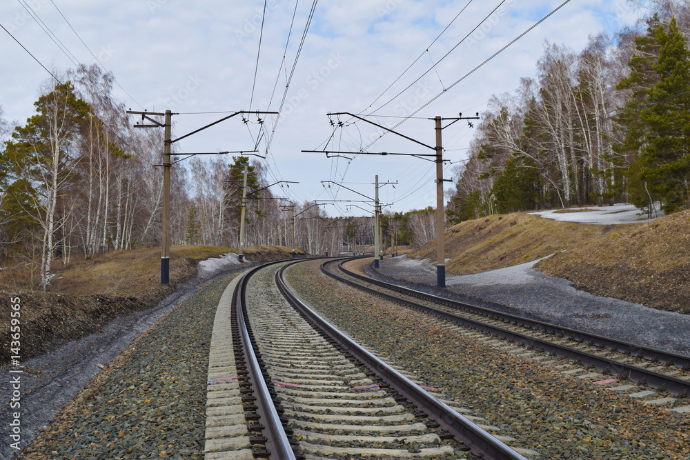 Trans-siberian railway in Siberian taiga forest in spring. Novosibirsk, Siberia, Russia. Trans-siberian railway in Siberian taiga forest in spring. Novosibirsk, Siberia, Russia.