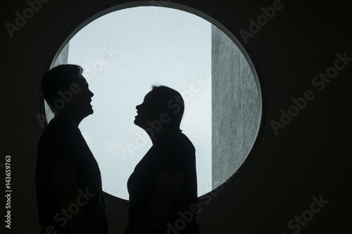 silhouette of couple lover in the window