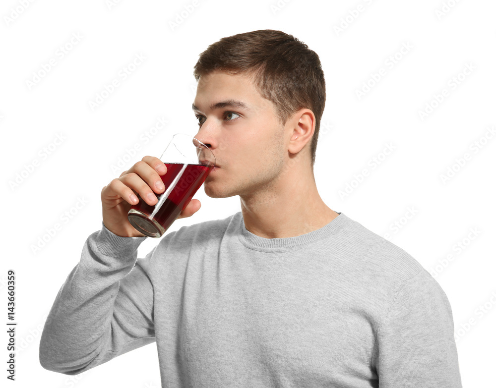 Young man drinking juice on white background Young man drinking juice on white background
