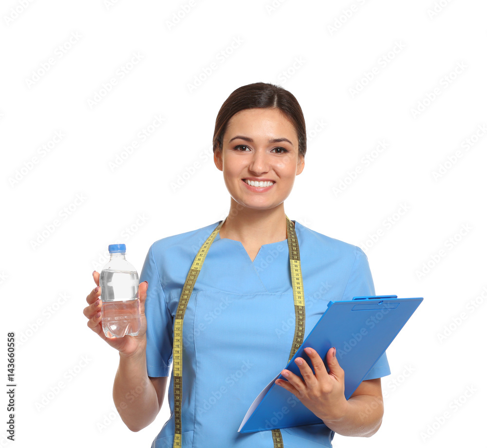 Female nutritionist with bottle of water and clipboard on white background Female nutritionist with bottle of water and clipboard on white background