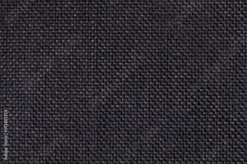 Dark black textile background closeup. Structure of the fabric macro