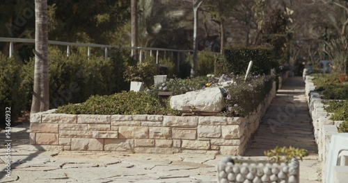 Tracking shot of graves at a military cemetery  photo