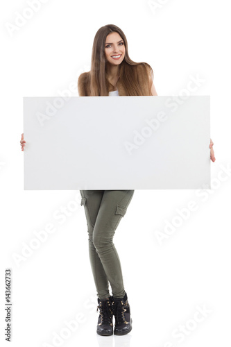 Smiling Woman Is Holding Placard And Smiling