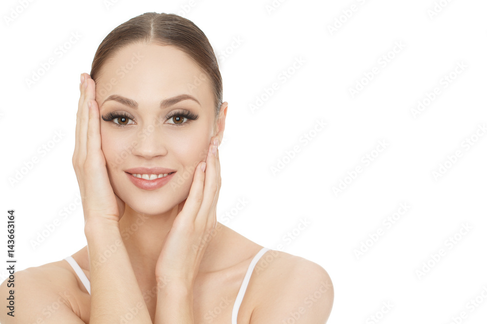 Loving her skin. Portrait of a beautiful young joyful woman posing touching her face isolated on white copyspace on the side. Loving her skin. Portrait of a beautiful young joyful woman posing touching her face isolated on white copyspace on the side.