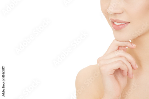 Stunning look. Cropped studio shot of a beautiful young woman smiling with her hand to her chin isolated on white copyspace on the side.