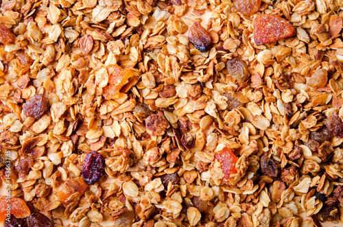 Homemade granola with honey, oatmeal, nuts, raisin, cranberry and dried apricots