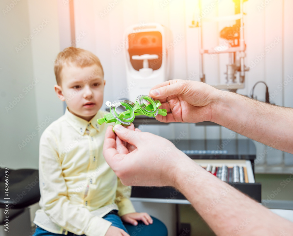Trial frame. Glasses prescription for a child. Child's hypermetropy. Child's shortsightedness. Child's myopia. Child's longsightedness. Ametropy correction with glasses. Trial frame. Glasses prescription for a child. Child's hypermetropy. Child's shortsightedness. Child's myopia. Child's longsightedness. Ametropy correction with glasses.