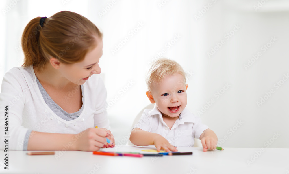 Mother with baby son with colored pencils Mother with baby son with colored pencils